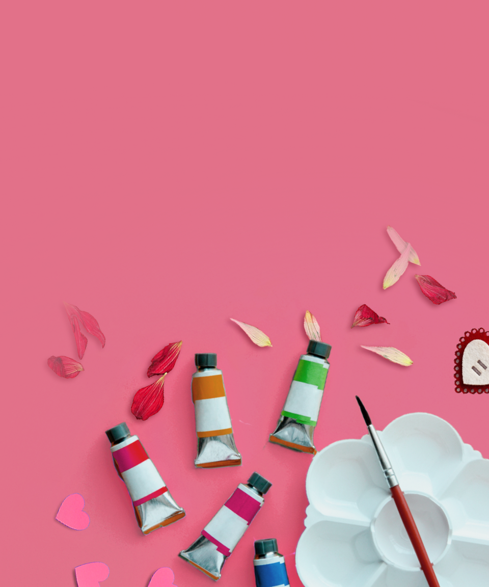 Various petals, pink hearts, and paints with an empty palette and a paintbrush for Confetti's Virtual BYO Valentine's Day Painting Class