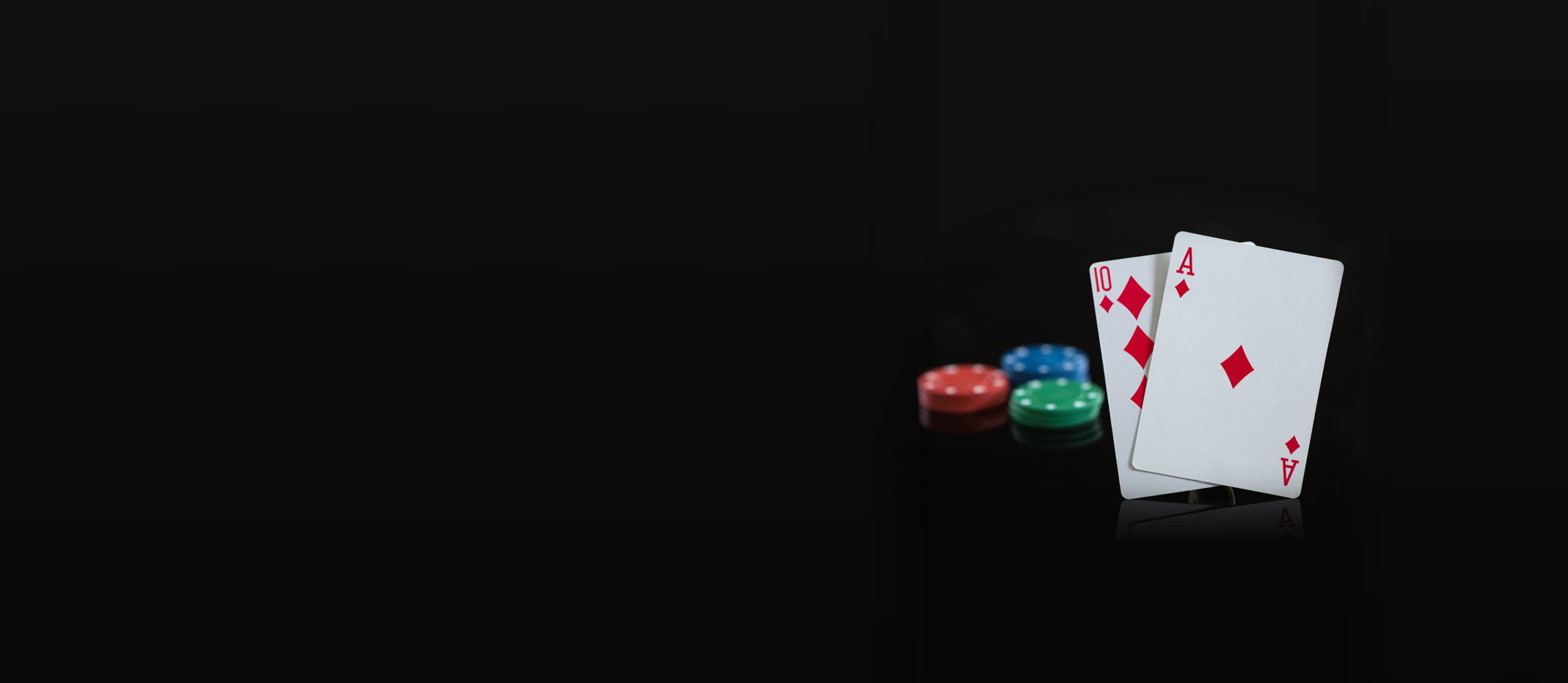 three stacks of poker chips and two cards hitting blackjack for Confetti's Virtual Corporate Casino Night 
