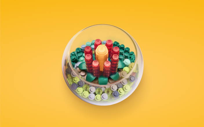 A glass terrarium with a flower made of toy bricks (preview)