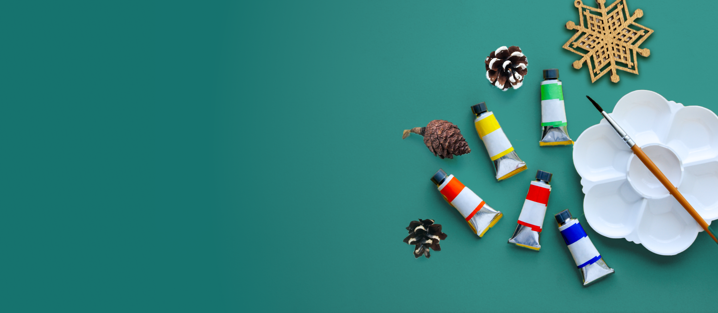 Tubes of paint, a palette, paintbrush, and festive winter holiday decorations (large)