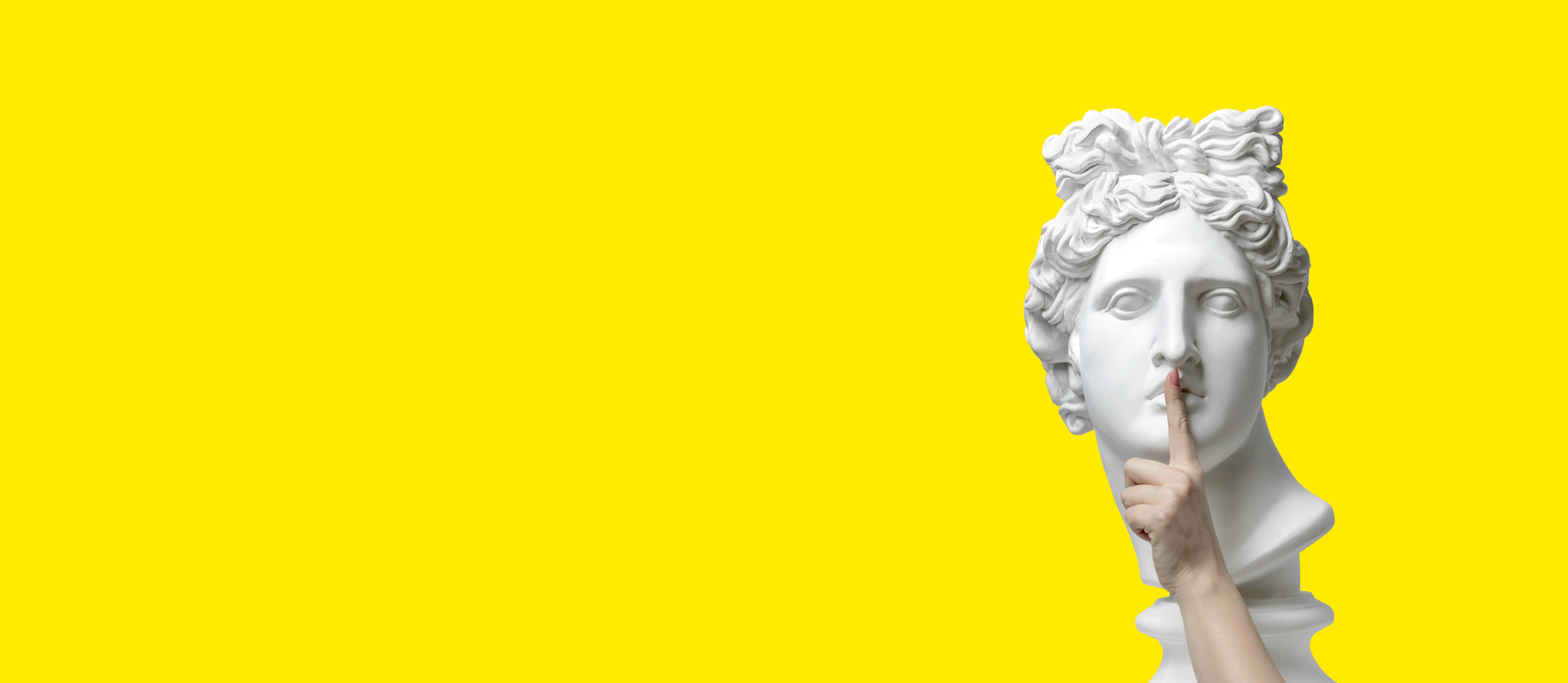 A finger held up to a statue head in a silencing gesture for Confetti's Virtual Taboo Game