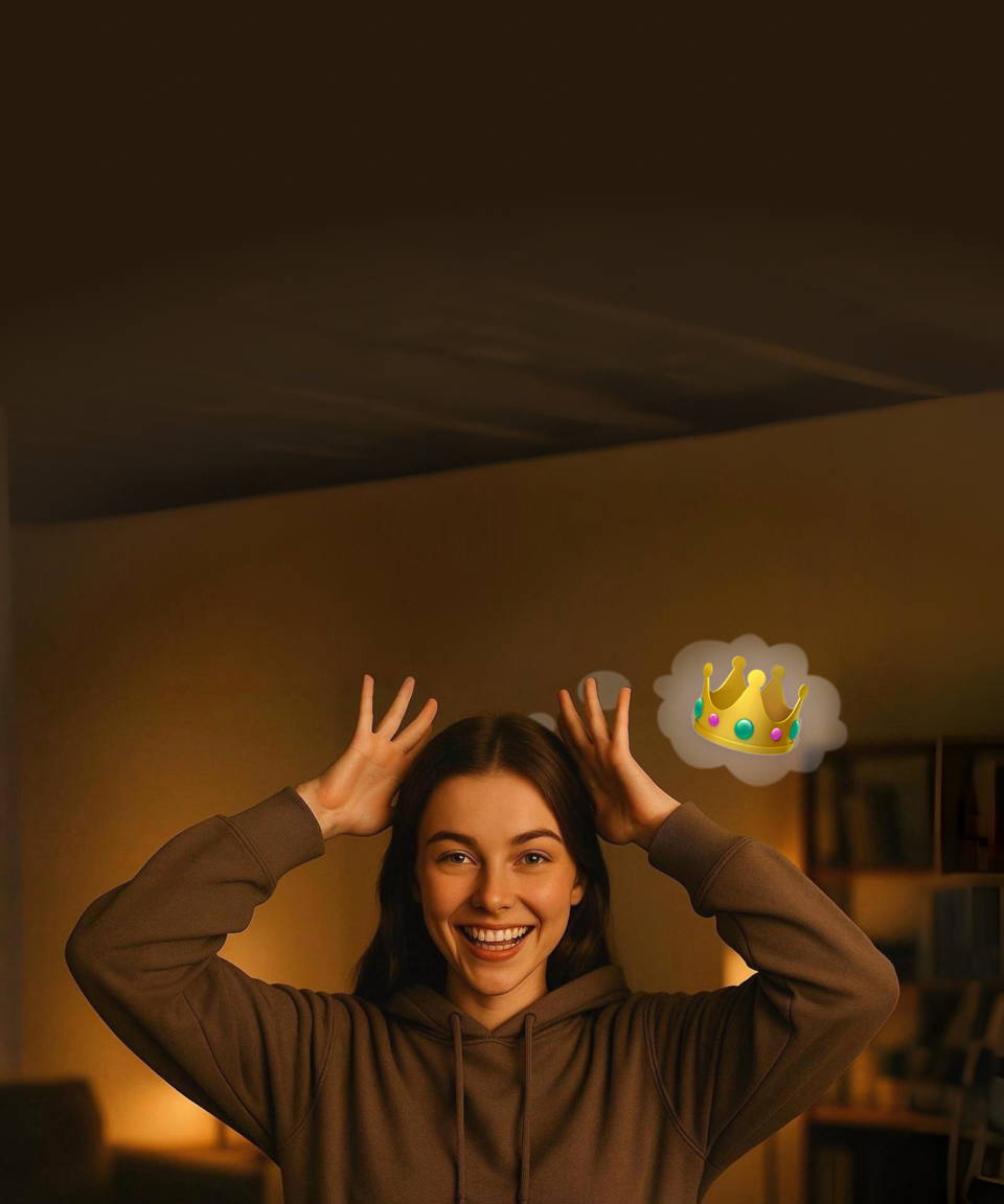 Lady Acting out emoji charades. She is acting out a crown on the top of her head with the crown emoji as a thought bugble