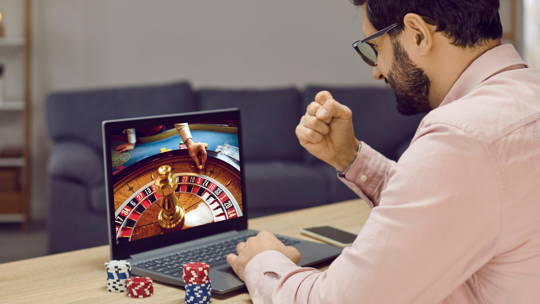 Man playing online poker and winning