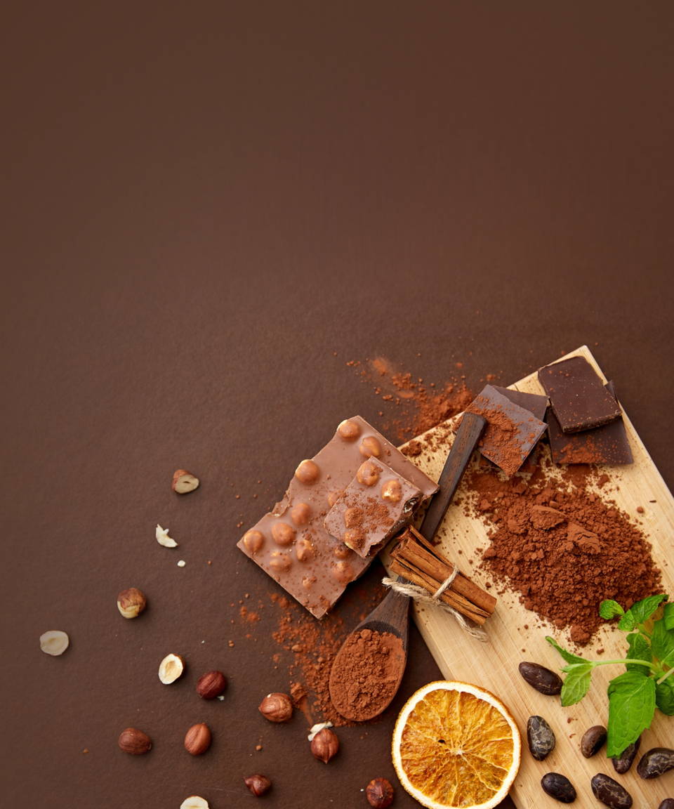 Chocolate bar with chopping board, coffee beans, orange, and cinnamon sticks (small)