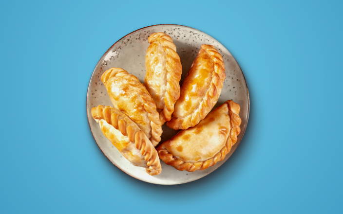 Golden empanadas on a plate for Confetti's Empanada Cooking Class (preview)