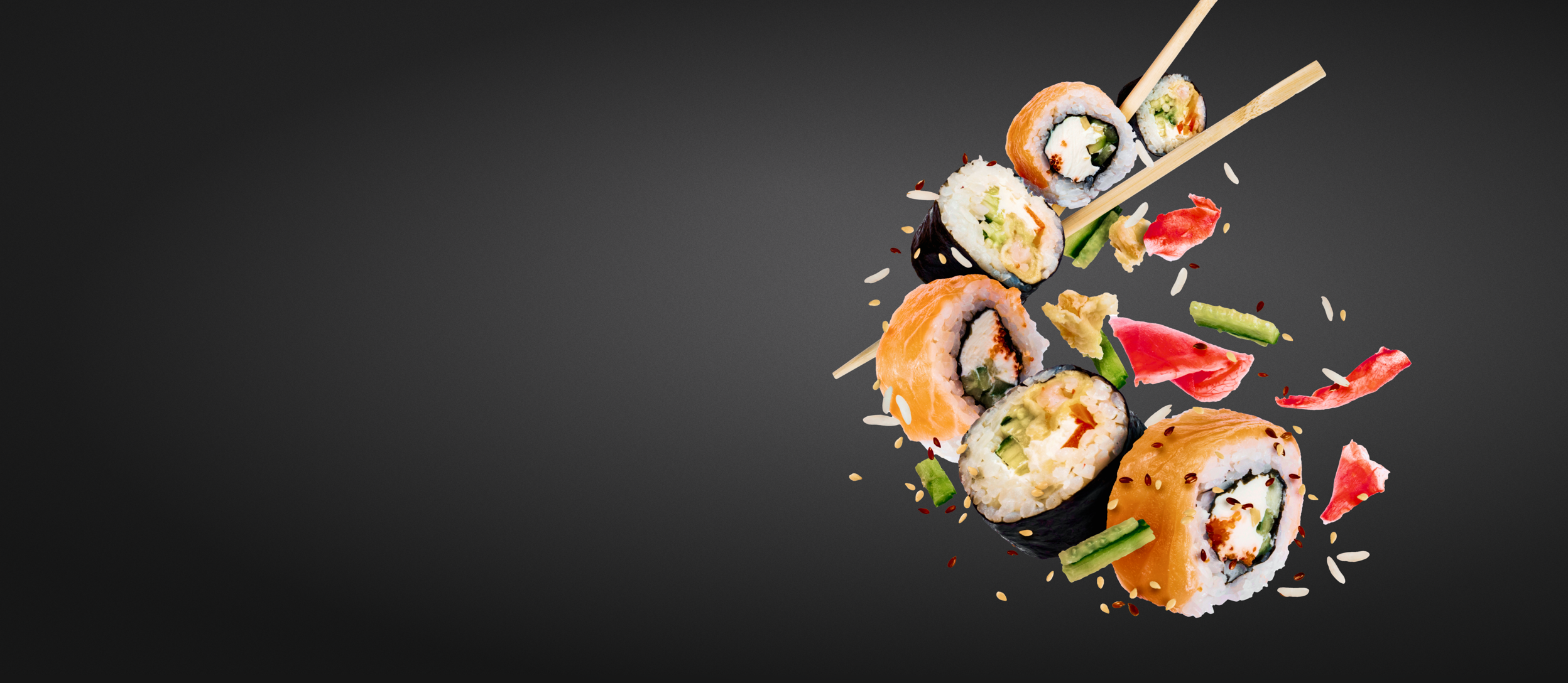 Pieces of sushi with chopsticks