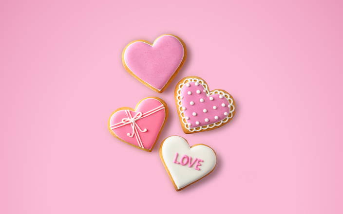 Heart shaped cookies iced and decorated for Confetti's Virtual Valentine's Day Cookie Decorating Classes Online