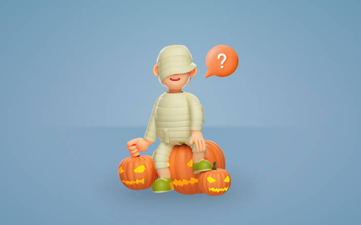 A person dressed as a mummy sitting on pumpkins playing Guess Who for Confetti's Virtual Get to Know You Games