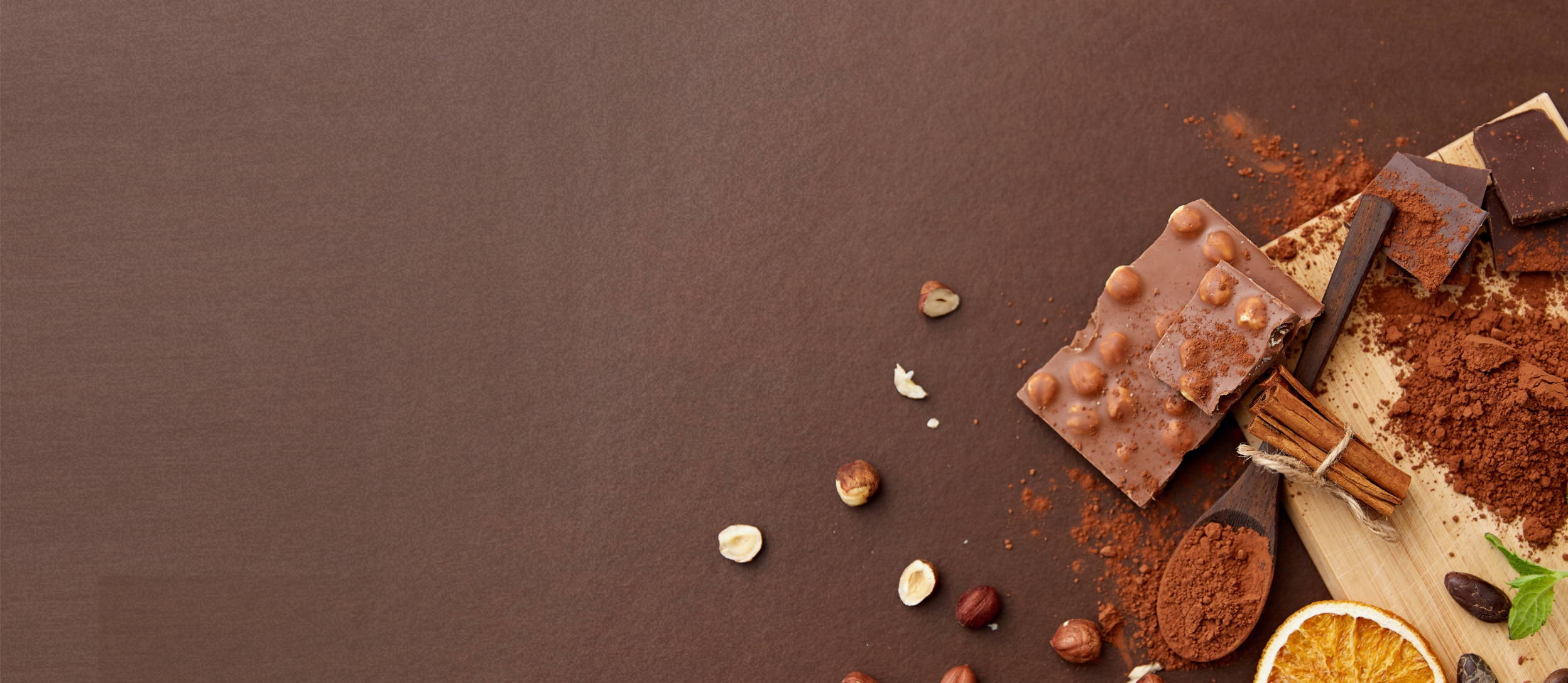 Chocolate bar with chopping board, coffee beans, orange, and cinnamon sticks (large)