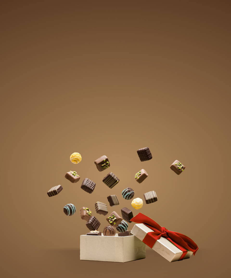 chocolates jumping out of a gift box for Confetti's Virtual Holiday Chocolate Tasting