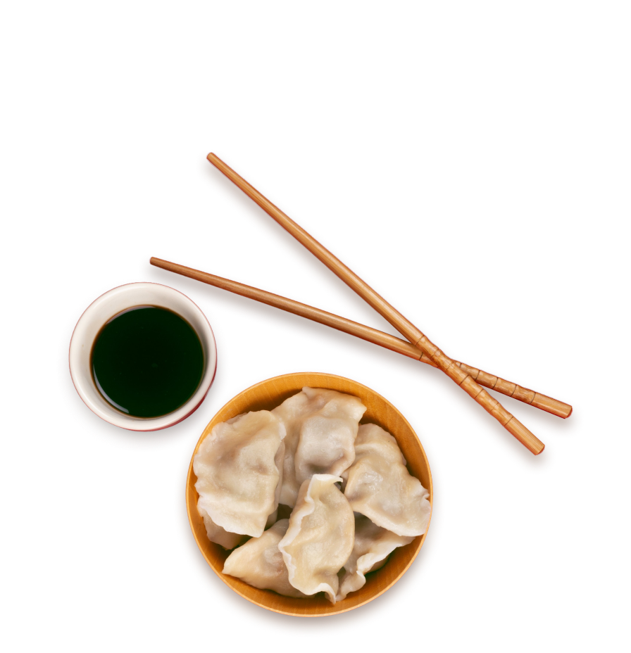Dumplings with soy sauce and chopsticks