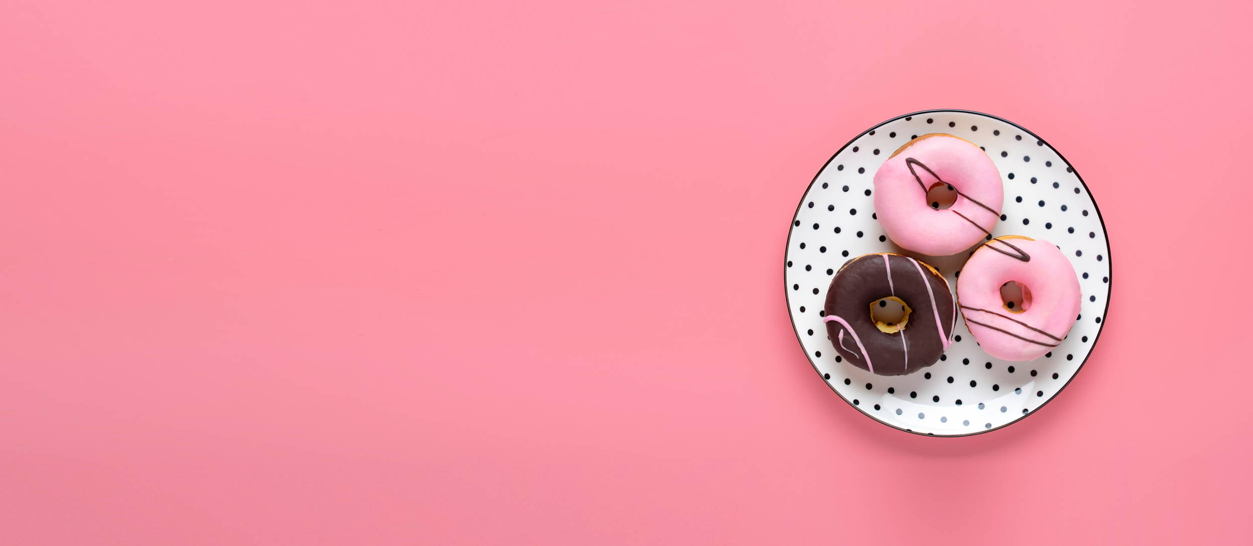 Strawberry and chocolate glazed donuts on polka dot plate (large)