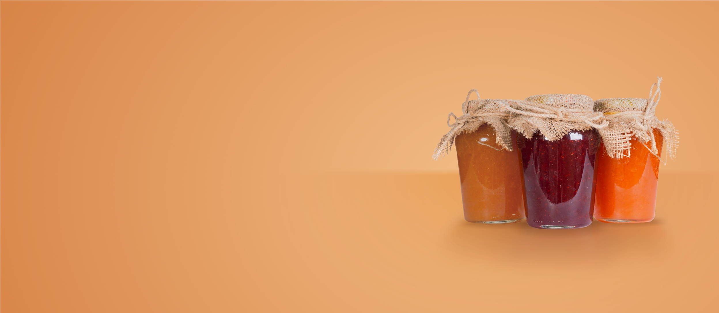 Three jars of jam tied with burlap and twine for Confetti's Virtual Jam Making Class