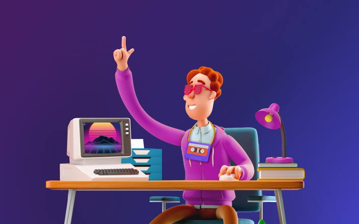 An employee wearing 80's themed hoodie and glasses next to a retro computer for Confetti's Virtual 80s Trivia