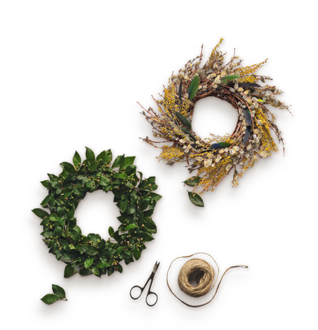 Leafy wreath and grapevine wreath with twine and scissors