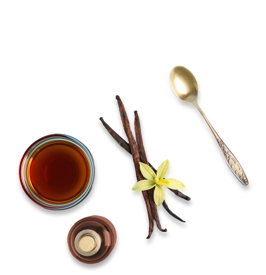 Glass of whiskey, vanilla bean, and spoon