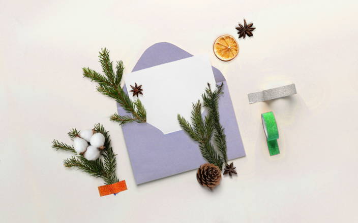 Letter in an opened enveloped with festive holiday decorations (preview)