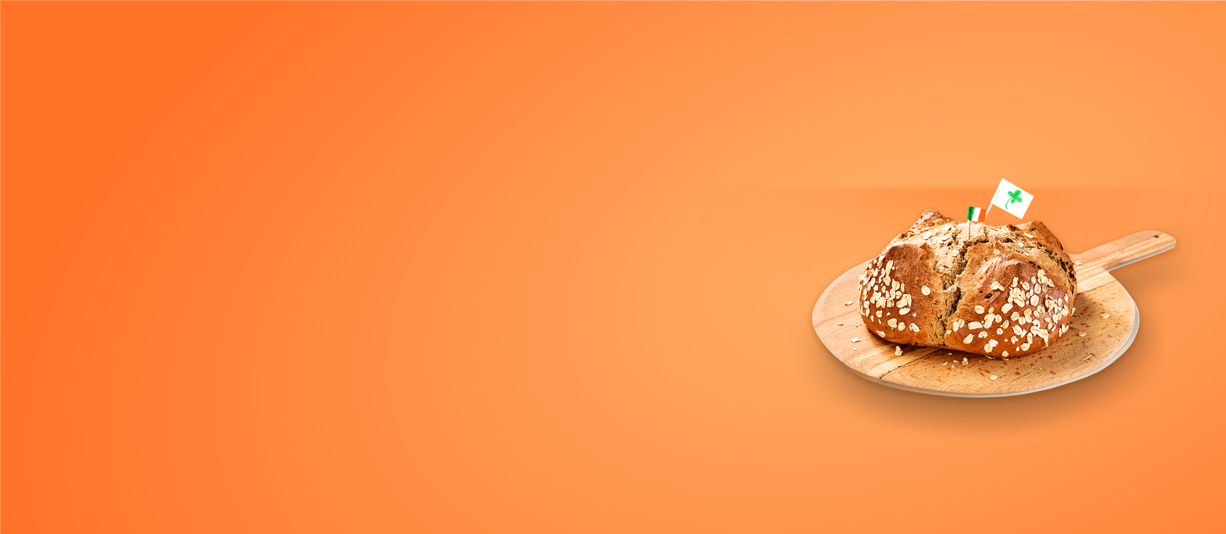 Freshly baked Irish soda bread on a wooden paddle (large)