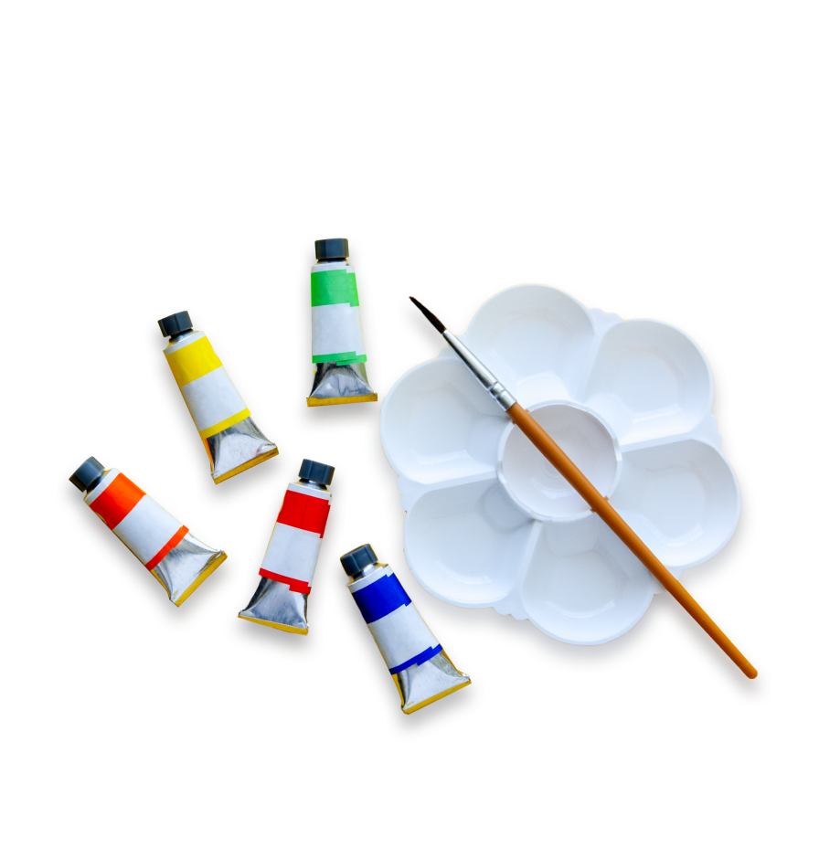 Tubes of different paint colors and a paintbrush sitting on a palette