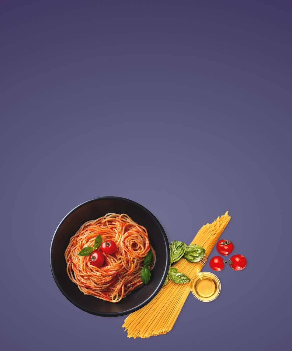 A plate of spaghetti next to a bundle of pasta, basil, and tomatoes for Confetti's Virtual BYO Pasta Making Class