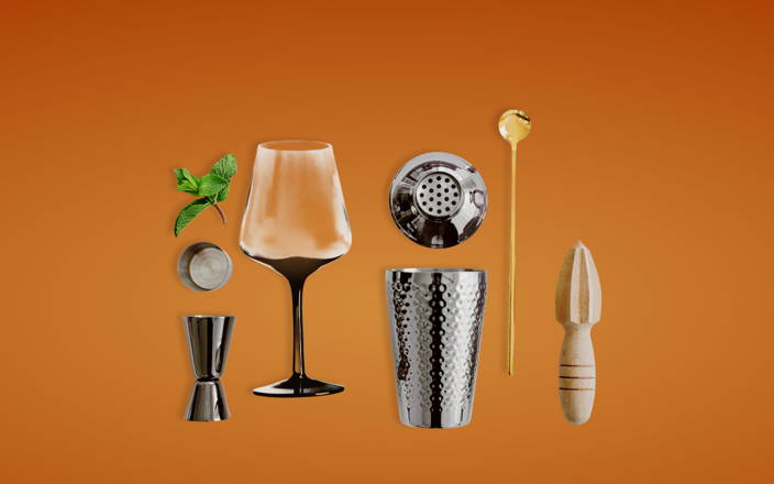 Various bartending supplies next to a glass and a sprig of herbs for Confetti's Virtual Black History Online Mixology Course