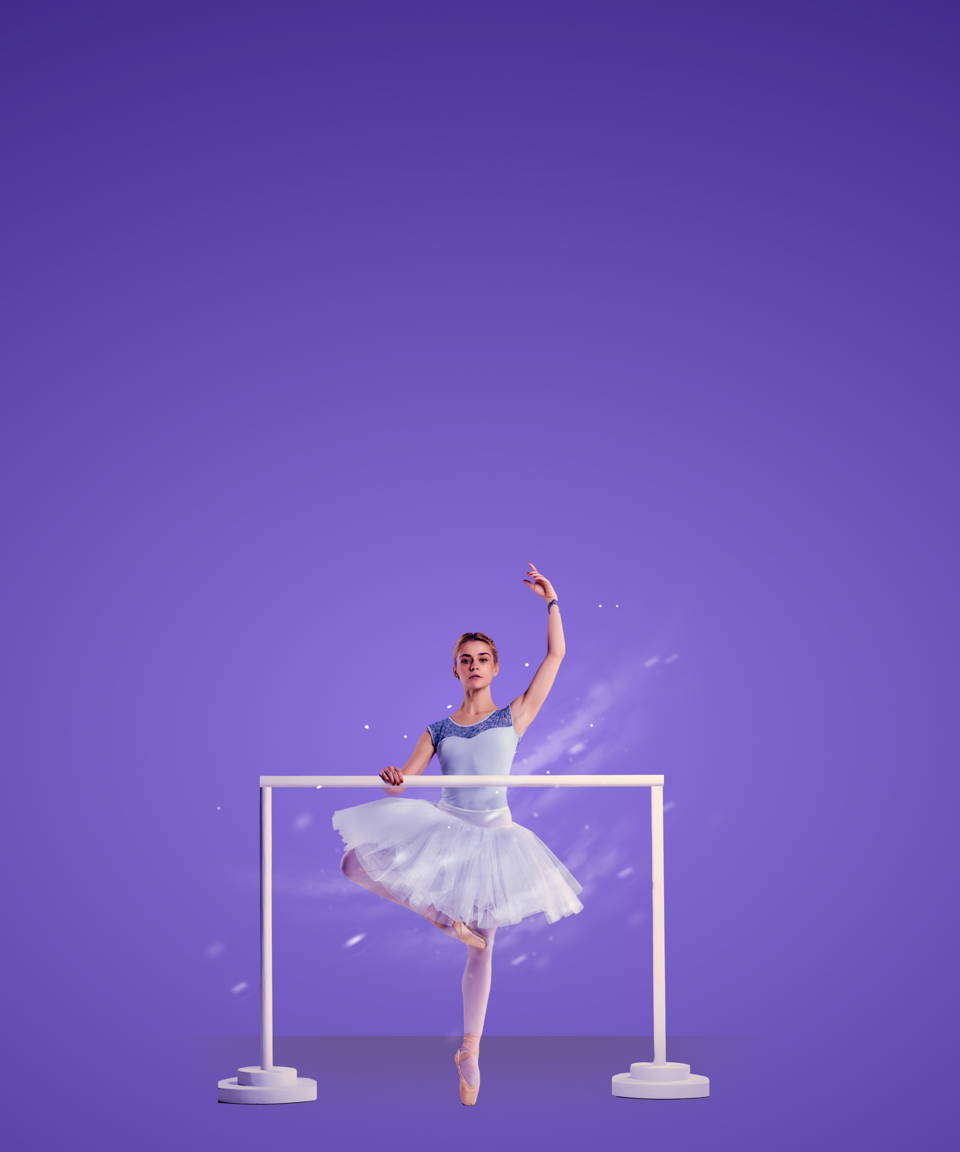 A winter ballerina in relevé at a ballet bar for Confetti's Team Building Dance Class (Small)