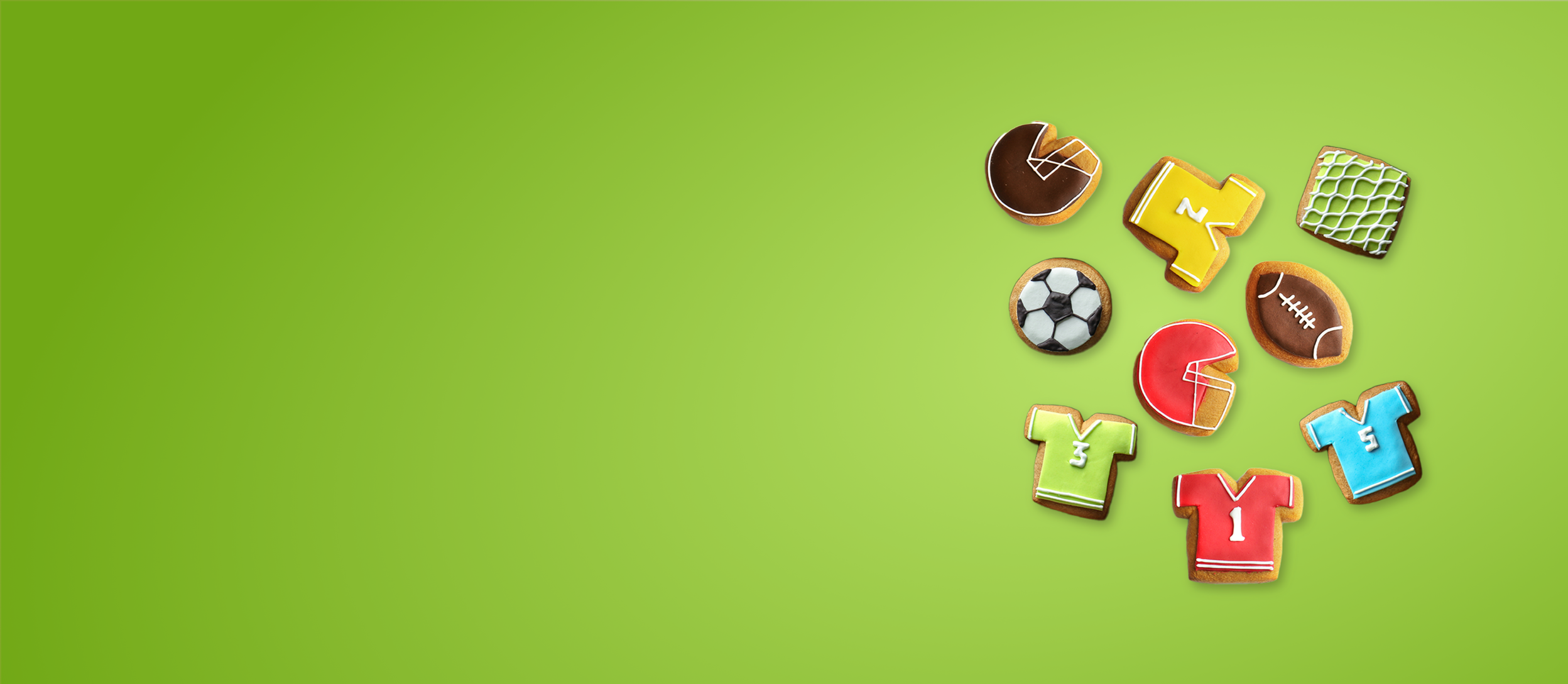 Various colorful sports theme cookies in shapes like helmets, jerseys, balls, and more for Confetti's Virtual Sports Cookie Decorating Class