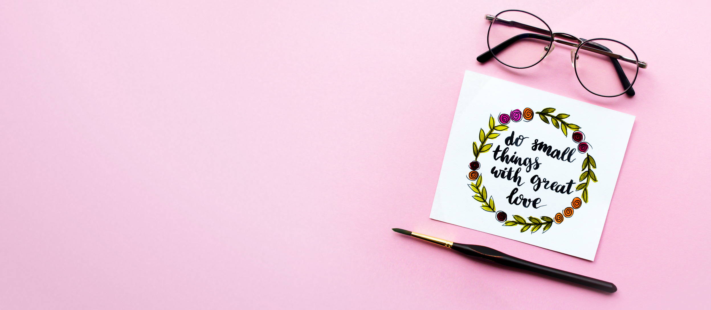 Glasses, a pen, and a card from a BYO Hand Lettering Class (large)