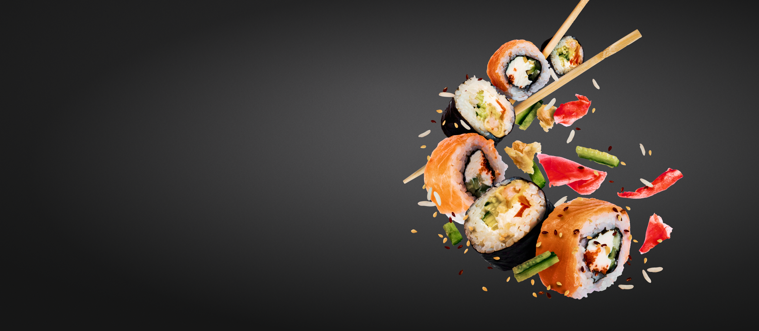 Pieces of sushi with chopsticks