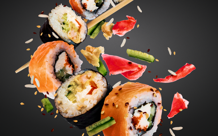 Pieces of sushi with chopsticks