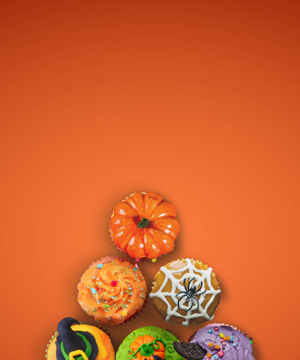 Halloween decorated cupcakes with pumpkins, witch hats, and spiders (small)