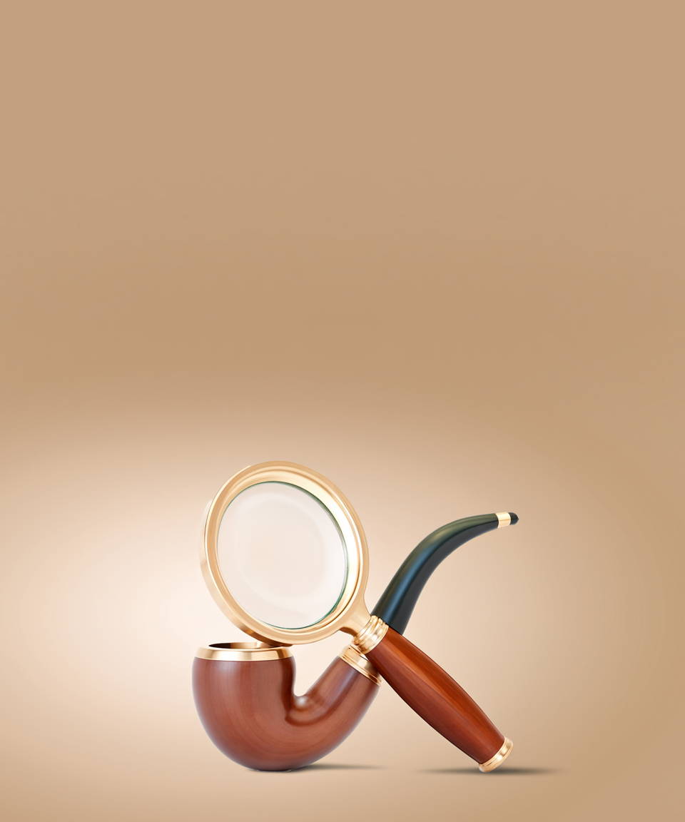 Magnifying glass propped against wooden pipe (small)