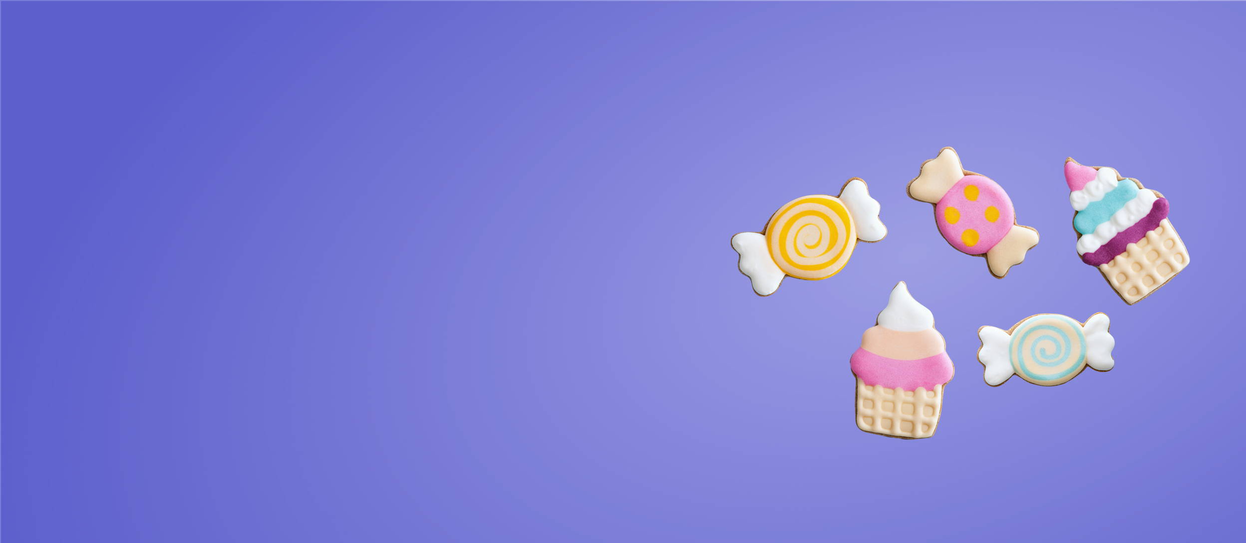 Colorful, iced cookies in cupcakes and candy shapes for Confetti's Virtual Cookie Decorating Class