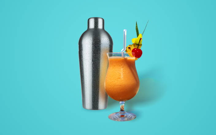 A fruity summer cocktail in front of a metal shaker for Confetti's Virtual Cocktail Class