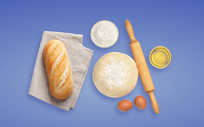 A loaf of bread and baking ingredients for Confetti's Virtual Bread Making Class
