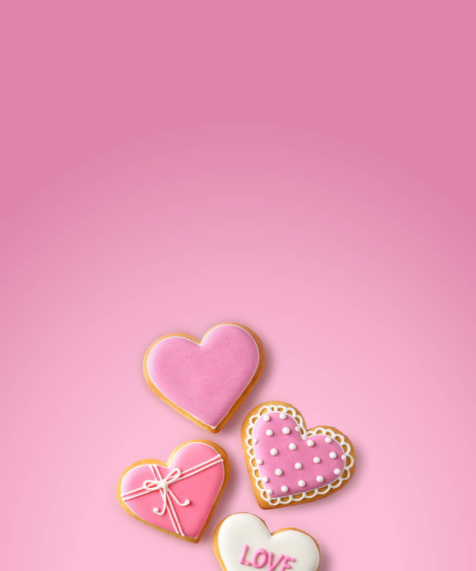 Heart shaped cookies iced and decorated for Confetti's Virtual Valentine's Day Cookie Decorating